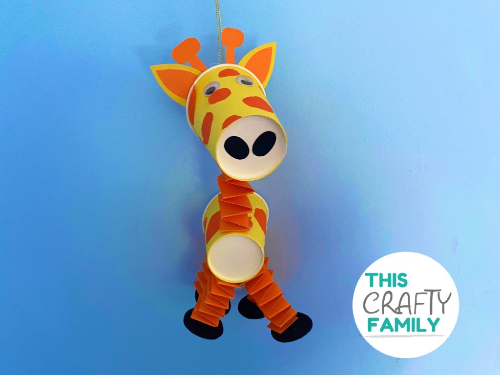 Paper cup giraffe puppet - This Crafty Family